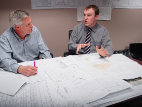 Calvin Pol, director of planning and building for the township of North Dundas, reviews subdivision plans with Mayor Eric Duncan. More than a dozen developers have submitted proposals for new residences across the municipality, keeping Pol and his staff very busy.
Staff photo/CHERYL BRINK