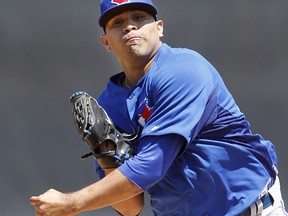 Struggling Blue Jays starter Ricky Romero is working with pitching coach Pete Walker to correct a recurring flaw in his mechanics that will give him a more natural, free-and-easy delivery. (Craig Robertson/Toronto Sun)