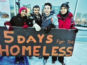 Left to Right: MacEwan University 5 Days for the Homeless team Racinne Gross, Pierce Brindza, Cameron McCoy and MacEwan Students Association president Jed Johns stand atop the MacEwan Centre for Sport and Wellness last week. The group camped outside for five days to raise over $13,000 for the Youth Empowerment and Support Services (YESS).  Photo by Trevor Robb/Edmonton Examiner