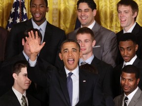 U.S. President Barack Obama waves as he welcomes the University of Kentucky men's basketball team to the White House in Washington to celebrate their 2012 NCAA championship, May 4, 2012. (REUTERS/Yuri Gripas)