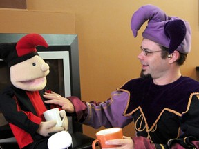 Jayden the Jester talks to his life sized puppet Jubey the Jester at the Black Water Cafe about their upcoming television debut on Dragon's Den. (BLAIR TATE, For the Observer)