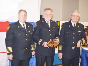 Capt. Roy Elderkin (centre) received his 40-year pin and plaque from retired fire chief Al Kilborn (right) and current fire chief Blair Mohr.