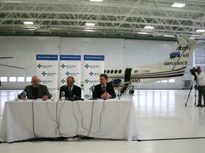 Chris Eakin/Fairview Post 
Above, Alberta Minister of Health Fred Horne, Ian Phelps - senior medical director of Mmergency Health Services, Minister of Municipal Affairs Doug Griffiths during the press event held March 13 at the Alberta Health Services transitional care centre at Edmonton International Airport. Above right, Premier Alison Redford answers questions in a scrum at the legislature. Most of the questions had to do with moving medevac flights out of the City Centre Airport but she also took some heat for cuts to university and college budgets.