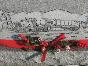 Submitted Photo

An engraving of a transport truck adorns the back of a monument in the Burford Cemetery.