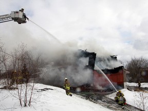 Greater Sudbury firefighters battle a rooming house fire on Elizabeth Street in Sudbury, ON. on Wednesday, March 20, 2013. See photo gallery at www.thesudburystar.com JOHN LAPPA/THE SUDBURY STAR/QMI AGENCY