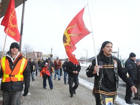 Idle No More protesters march through the streets of downtown Sudbury  on Wednesday evening, about 30 people took part in the event.
GINO DONATO/THE SUDBURY STAR