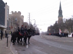 Police in Guelph, Ont., await the arrival of Const. Jennifer Kovach. (Kate Schwass-Bueckert/QMI Agency)