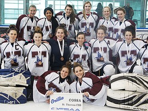 The St. Theresa Titans celebrate their bronze medal victory at the 2013 OFSAA girls AA hockey championships Wednesday in Orillia. (Photo submitted)