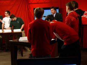 West Ferris, left, and Chippewa secondary school students prepare for the start of a round of Reach for the Top, Thursday, March 21, 2013, while moderator Jeff Serran looks on. The teams are competing for a chance to represent the region in the provincial finals in May.