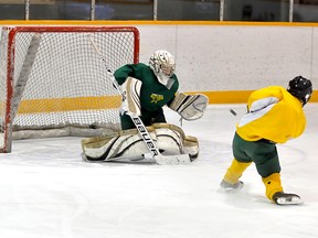 The Timmins Trademark Mechanical North Stars will travel to Sault Ste Marie this weekend to open the Northern Ontario Peewee 'AAA' Hockey League final on Saturday against the Greyhounds. North Stars goalie Dakota McArthur flashes the glove on a Keenan Bertrand shot at practice on Thursday at the Archie Dillon Sportsplex.