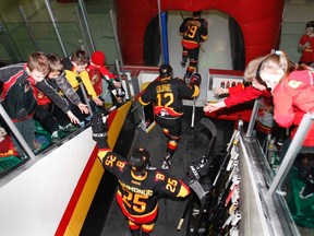 Young Belleville Bulls supporters cheer as their team get on the ice before playing the Mississauga Steelheads in the opening game of OHL Eastern Conference playoff first round action at Yardmen Arena in Belleville Thursday, March 21, 2013. - FILE/JEROME LESSARD/The Intelligencer/QMI Agency