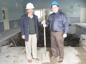 Muslin Khan, general manager of the Cornwall Super 8, and Mike Bedard, owner of Platinum Pools & Spas, stand in the construction zone of the former pool at the hotel in Cornwall. The project is targeted for completion by April with an open house in May. 
Staff photo/ERIKA GLASBERG