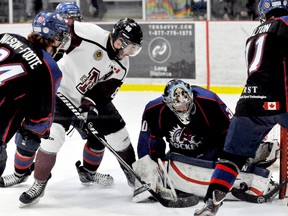 Chatham Maroons' Blake Blondeel tries to jam the puck past Strathroy Rockets goalie Dalen Kuchmey in Game 5 of their GOJHL Western Conference semifinal Thursday at Memorial Arena. The Maroons won 6-2. (DIANA MARTIN/The Daily News)