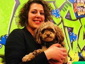 YOUCAN Edmonton program manager Mandy Halabi poses with her dog Bruno at the YOUCAN offices (11124 130 Street. TREVOR ROBB Edmonton Examiner
