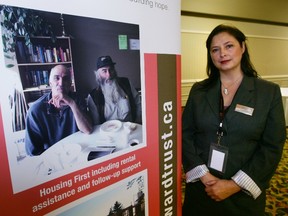 Susan McGee, executive director of Homeward Trust Edmonton, is seen  next to a Homeward Trust poster. The not-for-profit organization recently received a $19.4-million investment from the federal government’s Homelessness Partnership Strategy. FILE PHOTO QMI Agency
