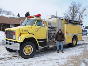 White Fox fire chief with the recently purchased second fire truck for the village.