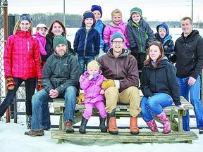 Members of the Lakeside Community Garden pose with some of their children in front of the snow-covered site that will soon be springing to life. Front row- Tom Martinek, Adele Booth, Chris Booth, Lois Bulch. Back row - Sarah Martinek, Ellen Goldring, Danielle Chanda, Henry Goldring, Noah Booth, Lilah Booth, Ryan Bulch, Alex Bulch, Jason Bulch.      Justin Smith-Kingston This Week