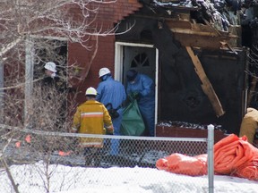 The second victim`s body being removed from the Elizabeth Street rooming house. (Sebastien Perth/The Sudbury Star)
