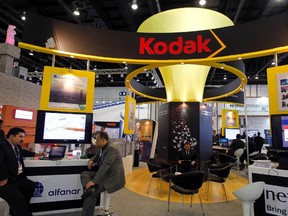 Exhibitors sit at the Kodak stand during the Gulf Information and Technology Exhibition (GITEX) at the Dubai World Trade Centre in Dubai October 14, 2012. (REUTERS/Jumana ElHeloueh)
