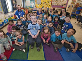 Five year old Ethan Golden (centre) is surrounded by his kindergarten classmates on Thursday. Students at Agnes Hodge School were encouraged to wear blue in support of their friend who has Juvenile Idiopathic Arthritis. The month of March is Childhood Arthritis Month. (BRIAN THOMPSON The Expositor)