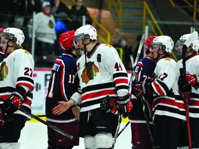 Brockville Braves players, including Griffen Molino (27), Kevin Kirisits (44) and Cory Wilson (17) shakes hands with the Cornwall Colts following the end of their CCHL Jr. A first-round playoff series, won by the Colts in six games (STEVE PETTIBONE/The Recorder and Times).