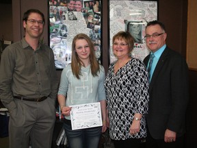 Bernd Heyde, youth pastor at Beaumont Community Church, Hailey Fredericks, recipient of the Chantal Bérubé Youth of the Month award for March, and Jo-Anne and Camille Berube pose in front of a memorial of Chantal at the Beaumont Community Youth Centre during the presentation on Mar. 20. BOBBY ROY/QMI AGENCY