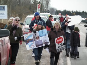 Protesters rallied Sunday near Grand Bend against wind farms planned for spots where tundra swans stop over on their migration to the Arctic. (JOHN MINER, The London Free Press)