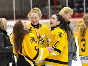 The Iroquois Falls Hornets triumphed 3-2 over Valley East on Sunday in the 2013 Northeast Region Ringette Championship Junior/Belle 'C' Division final at the McIntyre Arena. The game went to double overtime until the Hornets found the game-winner. Chelsie Longstreet, centre, who scored the game-winning goal celebrates with team-mates Britney Bujold, left and Britney Joseph, right, following the game.