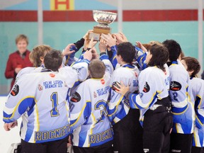 SARAH DOKTOR Simcoe Reformer
The Delhi Legion peewee Rockets celebrate by hoisting up the second place trophy the team received after falling to the Minto Mad Dogs during the OMHA peewee C finals on Saturday.