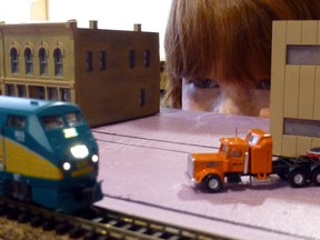 Dusty surveys a model-train layout. The hobby has taught him patience and perserverance, and forged a stronger bond with his father.