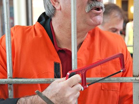 BRIAN THOMPSON, The Expositor

Brant MPP Dave Levac carries tools to help him break out of his jail cell at Lynden Park Mall on Saturday during the Crime Stoppers Jail and Bail fundraiser.