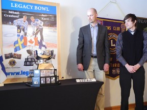 Laura Stricker. From left, Greg Sandblom and Juha Lehtola, the assistant goalie coach for the Sudbury Wolves, unveil the new Legacy Bowl at Finlandia Village on Saturday.