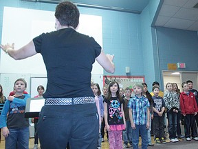 A.B. Daley Students practice the songs they were singing for the High River Lion's Music Festival.