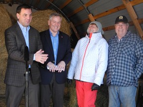 Ontario Progressive Conservative leader Tim Hudak, left, is flanked by local Tory MPP Jim McDonell and local farmers, Marika and Charles Stenger at their farm in Bonville on Saturday, as Hudak explained his party’s white paper on agriculture called Paths to Prosperity; Respect for Rural Ontario.