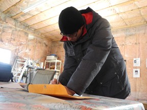 Atahontsison, organizer of the Occupy Turtle Island movement, signs his own petition to relocate the Canada Border Services Agency port of entry from Cornwall to the United States or back to the Cornwall Island.