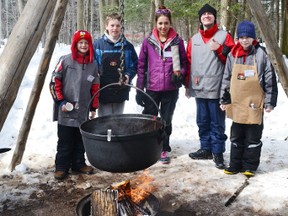 Pictured above (left to right) are volunteers Craeton Knoll, Ayden Kerslake, Niomi Vanderburgh-Elliott, Anthony Gowing and Eric Leis at their station in the historic demonstrations portion of the festival serving hot apple cider to the visitors who stopped by their station.