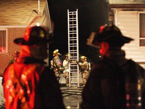 It took 22 firefighters and six trucks to battle a blaze that caused about $350,000 in damage late Friday night. A home, as well as two vehicles on Hawthorne Drive were heavily damaged. JOHN LAPPA/THE SUDBURY STAR/QMI AGENCY