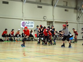 Portage la Prairie's Kim-Jong Wheels rounds the curve in front of the pack during a charity scrimmage held by the Plap City Rollers at the Southport Recreation Centre, Saturday. The league raised just over $400 for Central Plains Cancer Care thanks to the scrim and silent auction at the social which followed. (KENNETH HELSTROM/Submitted Photo)