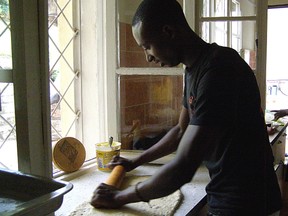 Faustin learns to make cinnamon buns.