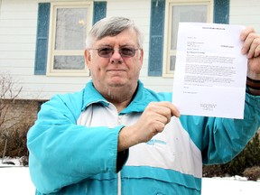 Tilbury area resident Randy Frankfurth holds a letter on Monday, March 25, 2013, he received from Trans Canada Solar Ltd. dated Friday, March 22, 2013, stating the company will auction-off  solar panels slated to be installed on the roof of his home if he doesn't pick them up by this Thursday, March 28, 2013. The letter comes just days after a company representative said the money drawn by Trans Canada Solar from a loan in Frankfurth's name would be returned and the contract would be cancelled. (ELLWOOD SHREVE/ THE CHATHAM DAILY NEWS/ QMI AGENCY)