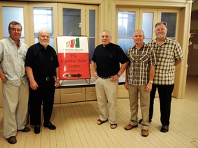 Operation Sharing president Frank Smith (second from left), a longtime volunteer who dedicated himself to helping Woodstock's impoverished, died March 23 after a battle with cancer. Smith is shown here with (from left) Operation Sharing chaplain and executive director Stephen Giuliano, Rev. Bruce Genge, The Cynthia Anne Centre For Addictions acting facilitator Phillip Wright and program director Bill Baleka, at a September 2011 press conference for that program. (Sentinel-Review file photo)