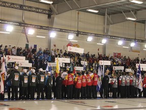 Curlers stand in the opening ceremonies of the Canadian Junior Curling Championships in Fort McMurray earlier this year. The host club, the Fort McMurray Oilsands Curling Club, hopes to grow their membership after the excitement created from the national event.  TREVOR HOWLETT/TODAY FILE PHOTO