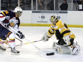 Kingston Frontenacs goalie Mike Morrison stops the Barrie Colts’ Andreas Athanasiou from in close during Ontario Hockey League  Eastern Conference quarter-final playoff action at the K-Rock Centre Monday night. (Laura Boudreau/For QMI Agency)