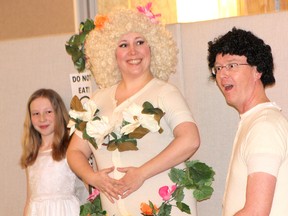 The Paddy Walker Heritage Society Dinner production of ‘The His-Story of Women’ on March 24, 2013 at the Best Western Plus Governor’s Inn saw a veteran cast of actors from the Kincardine Theatre Guild perform a comedic, yet historic and educational representation of women’s struggle for equality in Canada, leading up to the right to vote in the 20th century. The performance kicked off with a demonstration of how man was ‘led’ astray in the Biblical tale of Adam (John Low) and Eve (Stacey Millar), while her daughter Slayde Millar looks on. (TROY PATTERSON/KINCARDINE NEWS)