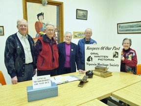 Some key members of the Nipawin Heritage Society gather together with
some of the unusual and personal heritage items that members brought
along to share. Nine directors in total were signed up at the AGM.