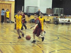 Cody Newman, dribbles the ball into the offensive zone in the Red versus Yellow game at Percy Baxter School on Saturday, March 16. The Whitecourt  Community Youth Basketball program will be one of the teams participating in the Fair Play Tournament at Percy Baxter School.
Barry Kerton | Whitecourt Star