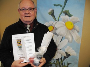 SARAH DOKTOR Times-Reformer
Larry Dawson, executive director of the downtown Simcoe Business Improvement Area, holds one of kits provided by the BIA for  its downtown Simcoe Drive-Thru Art Gallery. Kits are available not and must be returned by May 15.