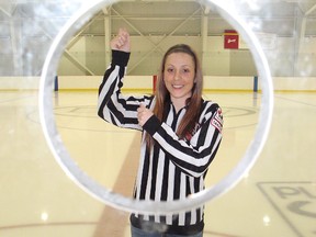 Julie Dexter has been invited to go far north to officiate a girls hockey tournament in Iqaluit, Nunavut this weekend. Here she poses for a photo at the Benson Centre.