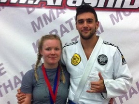 Husband and wife jiu-jitsu fighters Sarah and Zach Zacharias pose for a photo after their first jiu-jitsu tournament together at the Capital City Championships in Edmonton. Both of them managed to win medals at the event.  SUPPLIED PHOTO