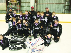 The Central Plains 2001 extended season team celebrates their tournament win in Foxwarren over the weekend. Coaches: (L-R) Todd Boychuk, Shane Moffatt, Greg Smith; back row: (L-R) Zak Smith, Logan Calder, Ben McCartney, Tanner Boyle, Logan Rands, James Weibe; middle: (L-R) Brandon McKenzie, Garett Maly, Aiden Panko, Matt Boychuk, Joey Moffatt; front: (L-R) Aiden Muirhead, Tyler Perry;(missing: Max Neill) (SUBMITTED PHOTO)